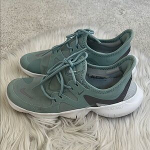 Nike teal colored Nike Free shoes